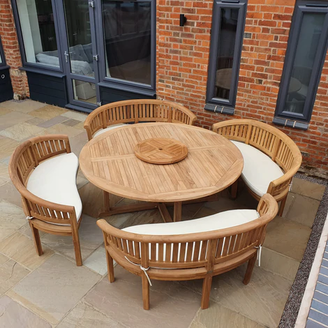 Teak garden dining set. 1.8m &ldquo;Titan&rdquo; round table, 4 bowwood style seats