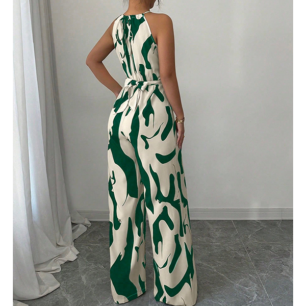 HALTERNECK EN KOEIENPRINT JUMPSUIT