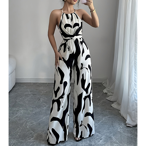 HALTERNECK EN KOEIENPRINT JUMPSUIT