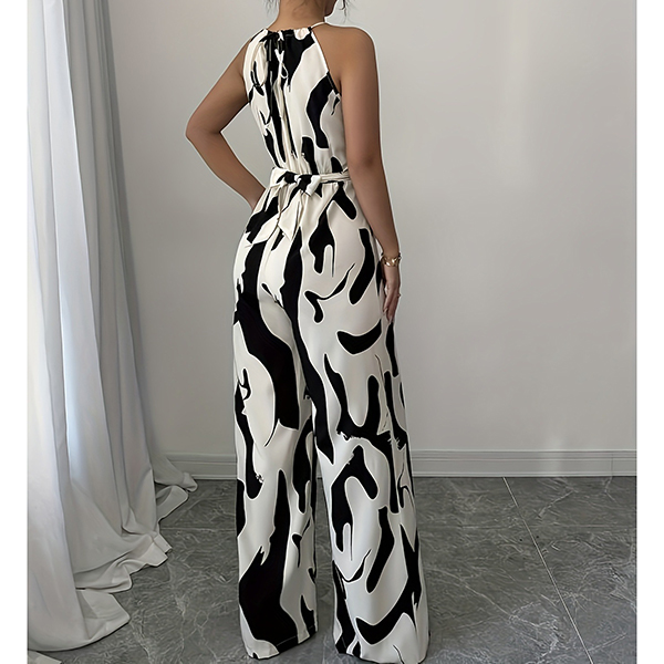 HALTERNECK EN KOEIENPRINT JUMPSUIT