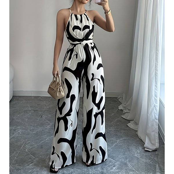 HALTERNECK EN KOEIENPRINT JUMPSUIT