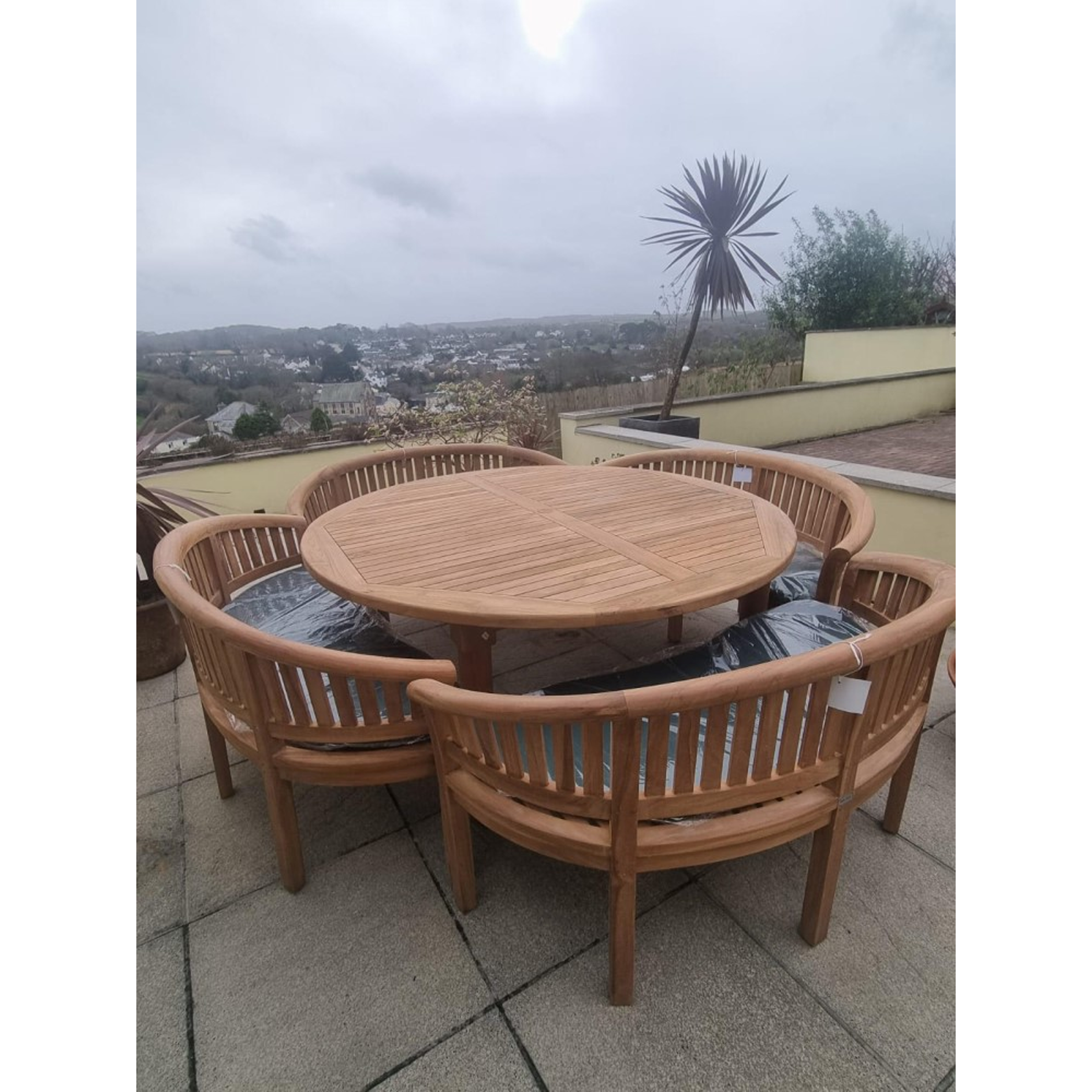 Teak garden dining set. 1.8m &ldquo;Titan&rdquo; round table, 4 bowwood style seats