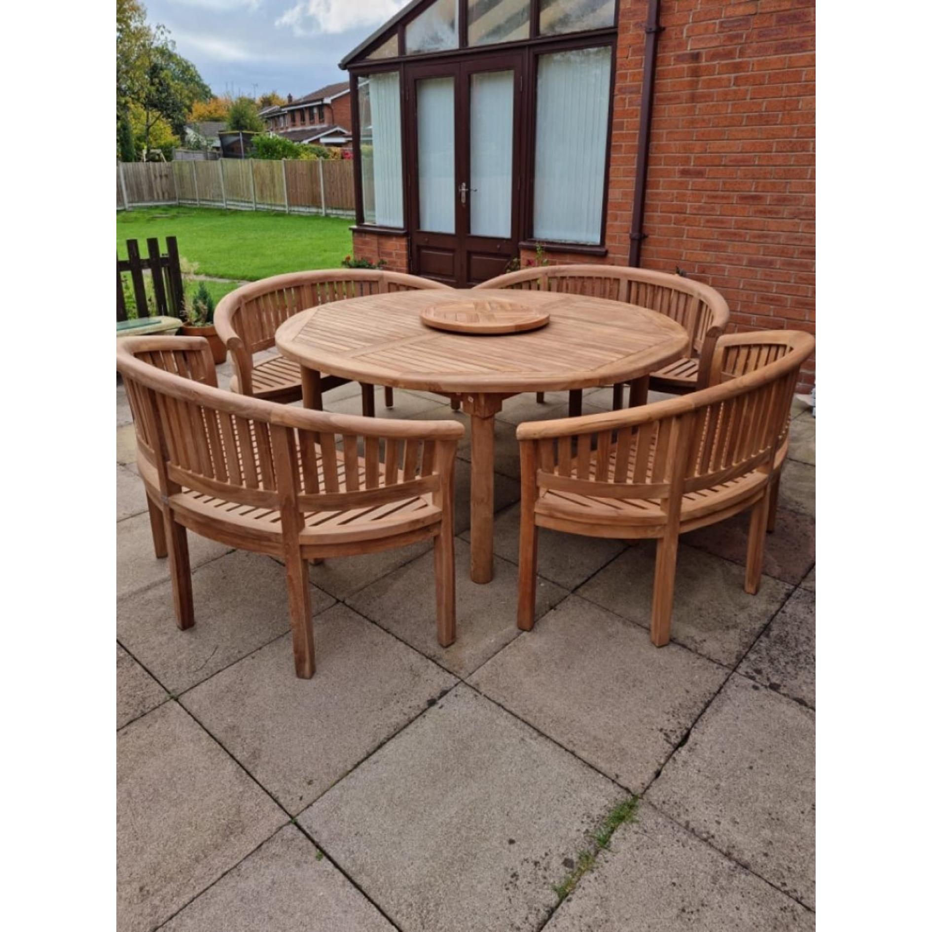 Teak garden dining set. 1.8m &ldquo;Titan&rdquo; round table, 4 bowwood style seats