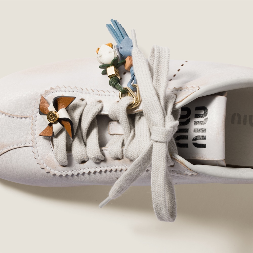 Leather pinwheel brooch