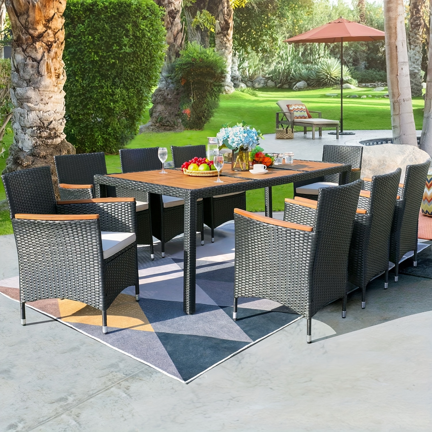 Patio furniture series, including a PE rattan chair and dining table set, with a table top made of Saka wood, and chairs featuring curved wooden armrests and cushions