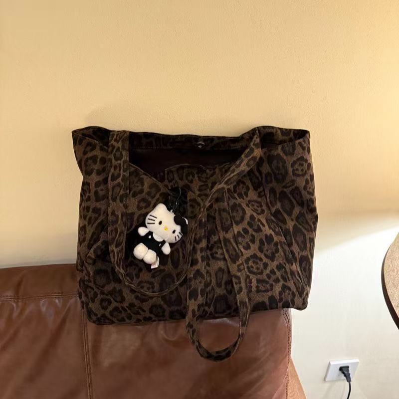 2025 Leopard-print canvas crossbody bag for women - large capacity, new style, suitable for daily commuting, versatile tote bag, shoulder bag at the underarm position