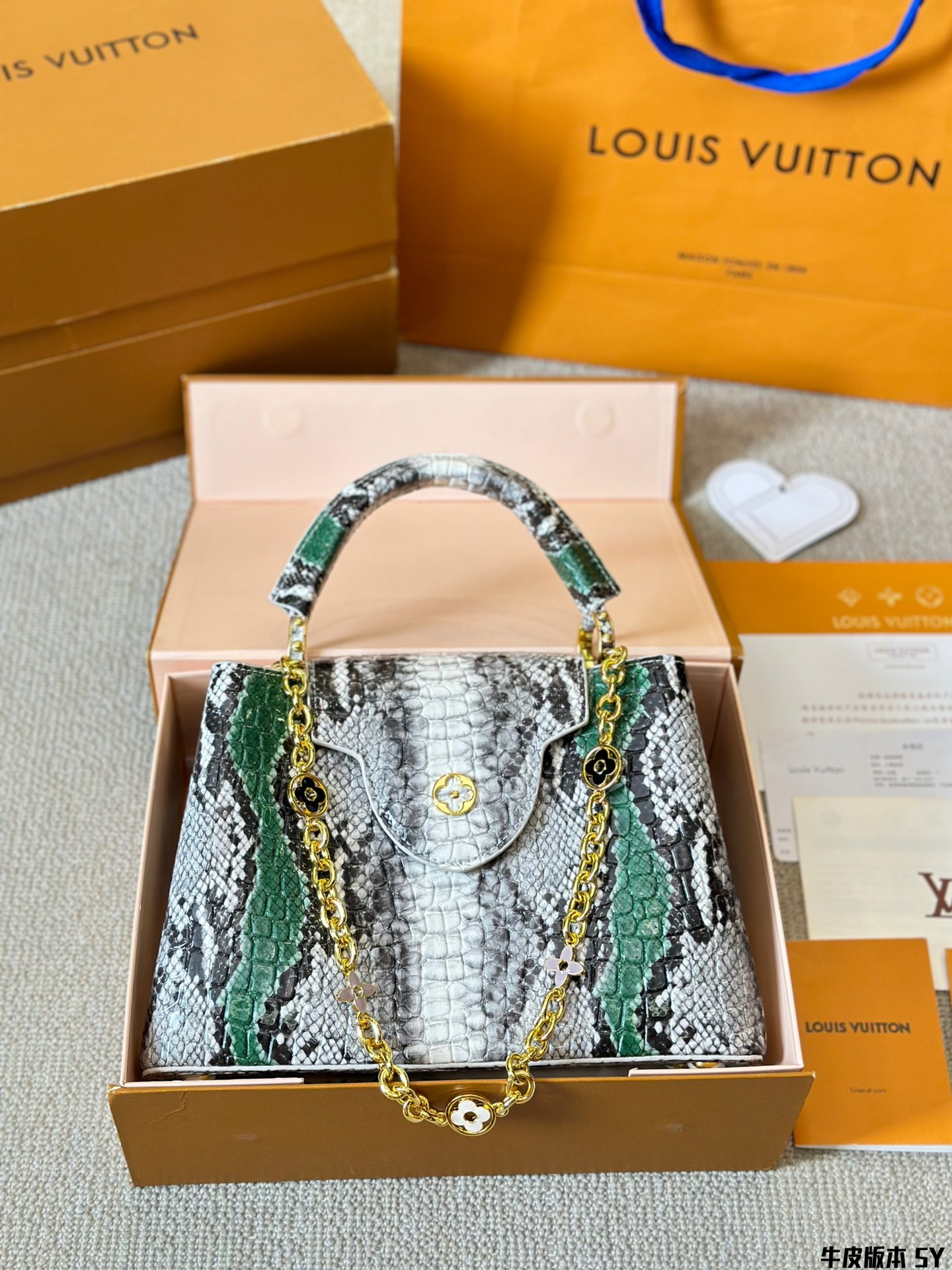 L design Capucines snake print handbag