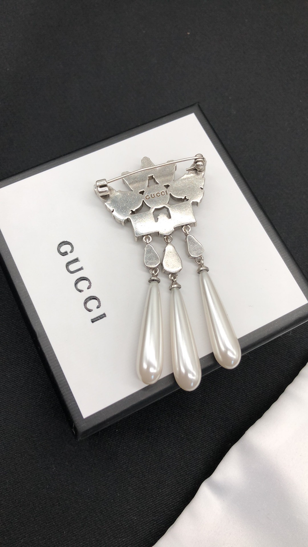 G design diamond brooch