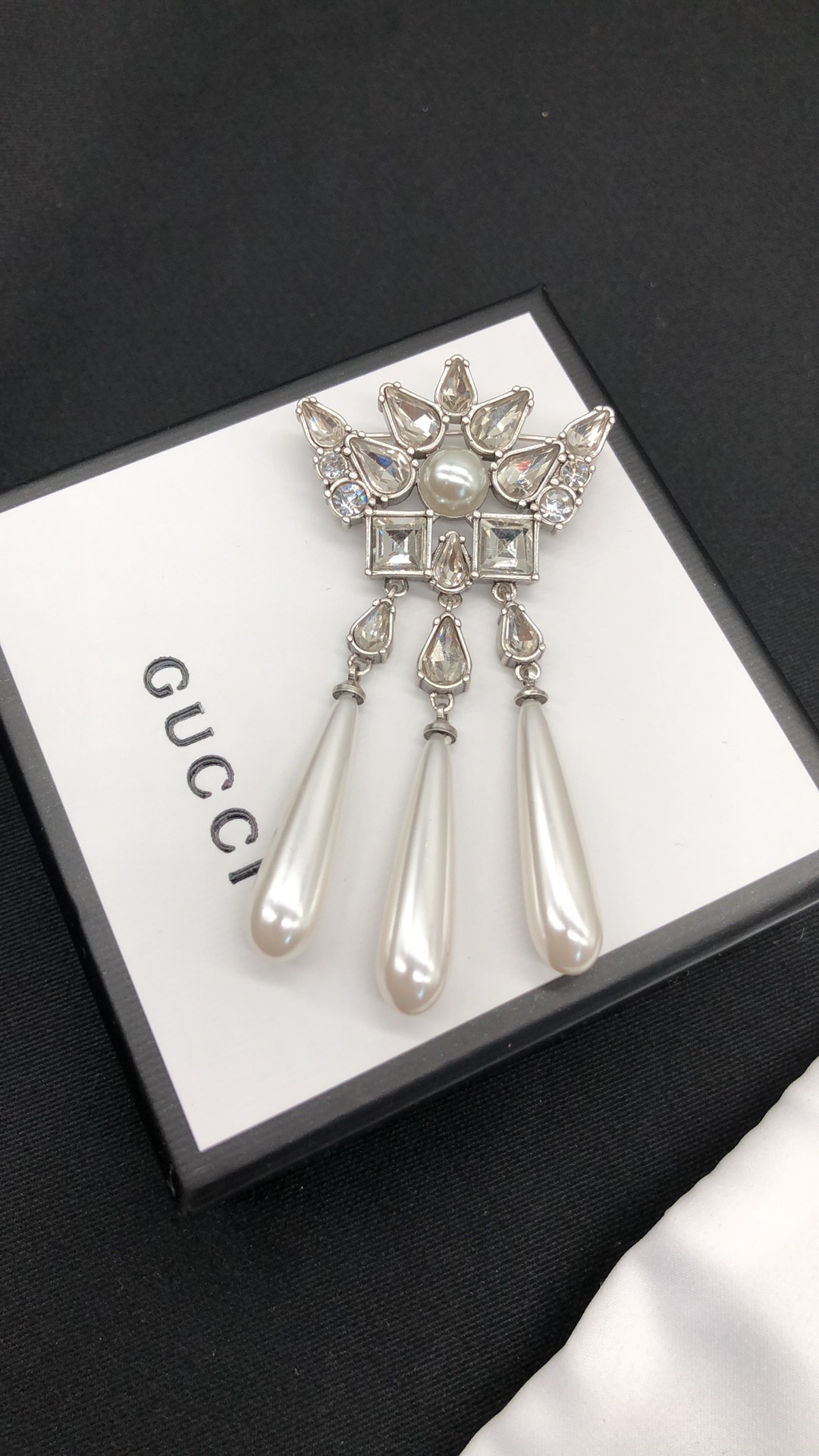 G design diamond brooch
