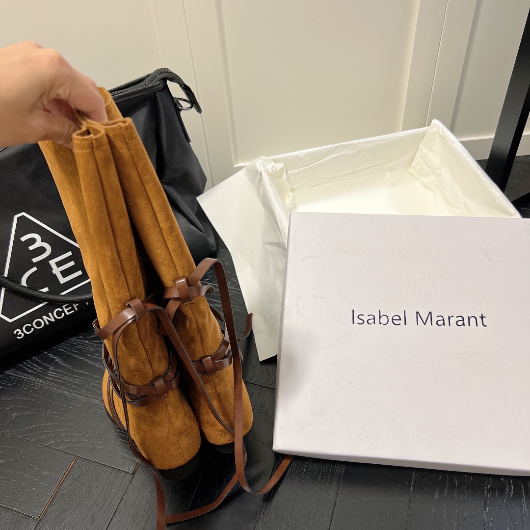 Isabel Marant strips style high knee boots