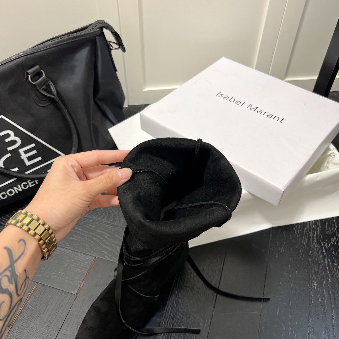 Isabel Marant strips style high knee boots