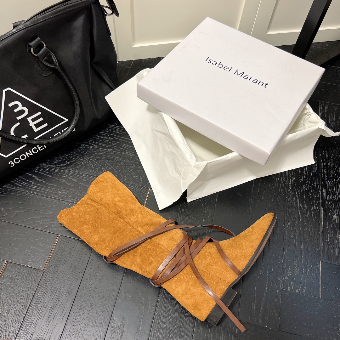 Isabel Marant strips style high knee boots