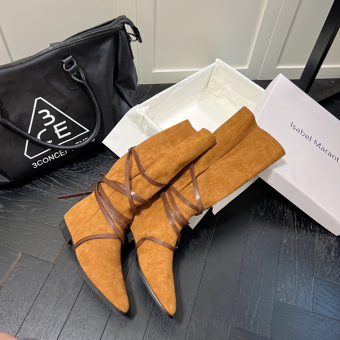 Isabel Marant strips style high knee boots