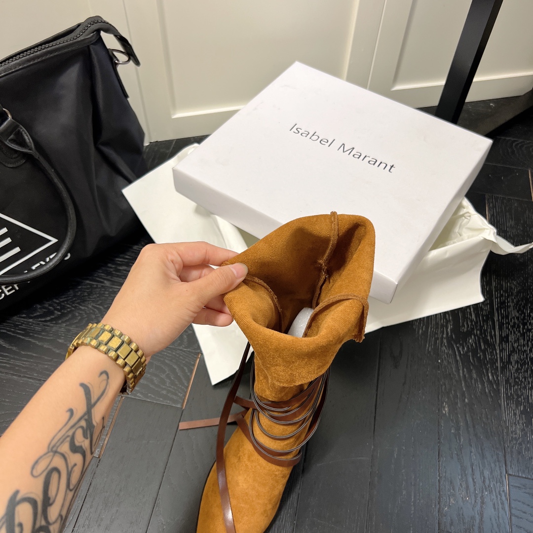 Isabel Marant strips style high knee boots