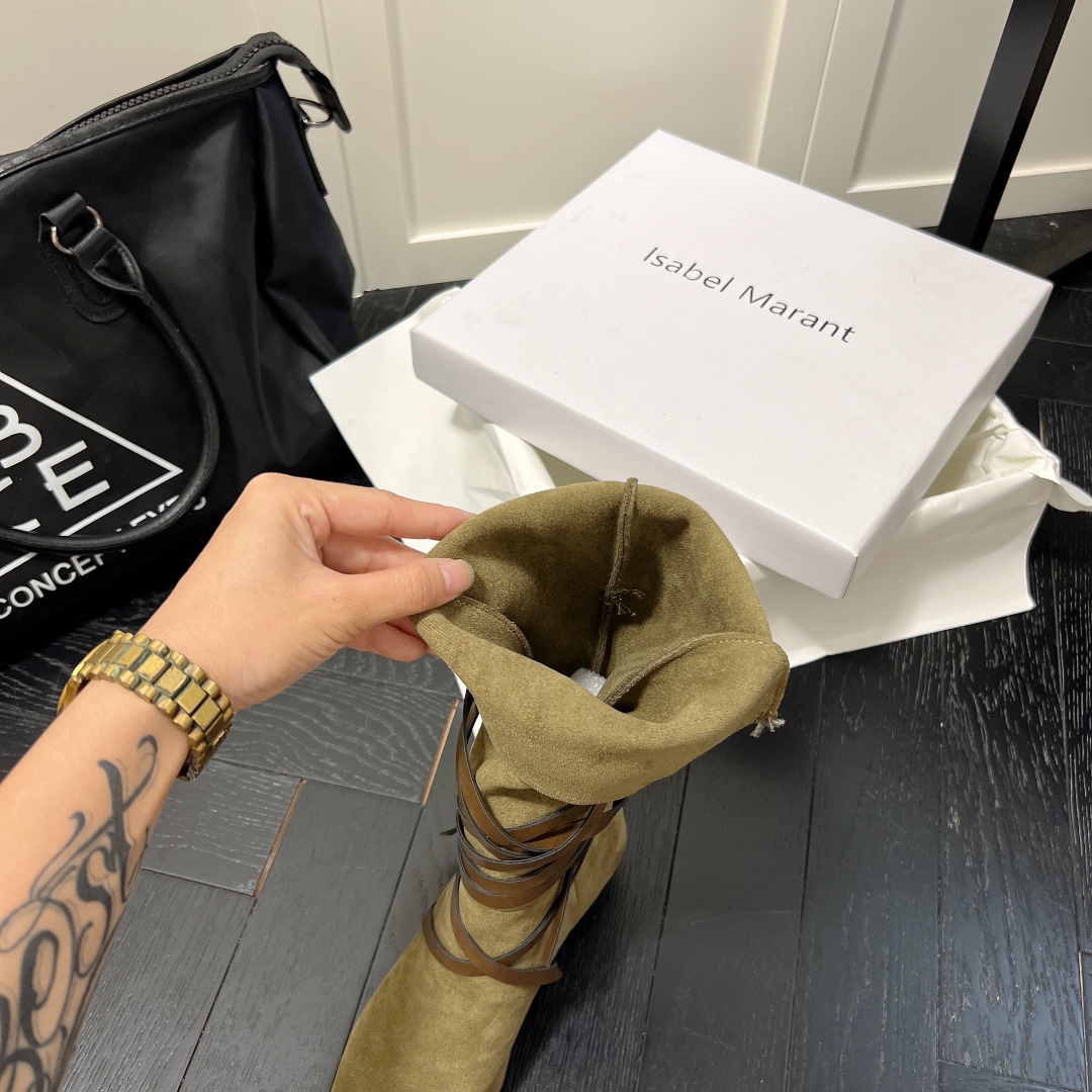 Isabel Marant strips style high knee boots