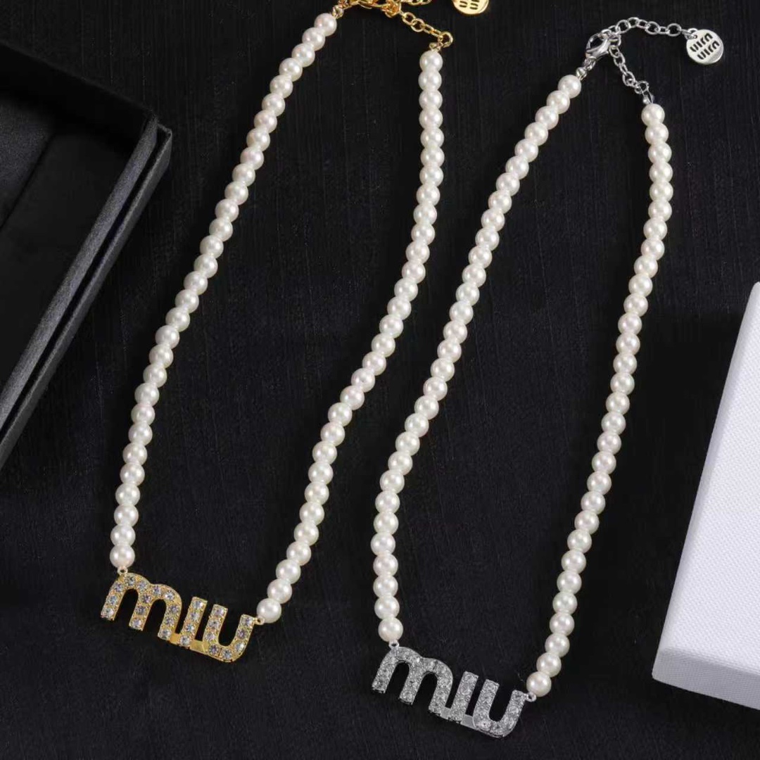 M design pearl necklace