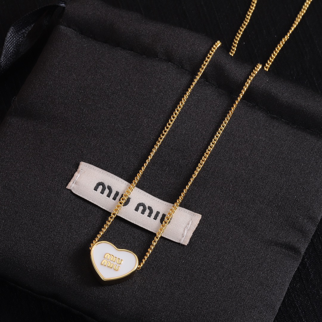 M heart design earrings