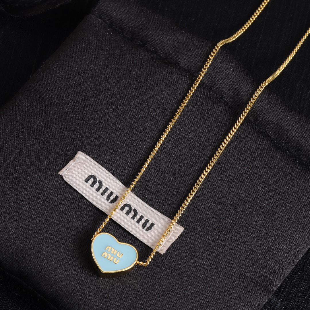 M heart design earrings