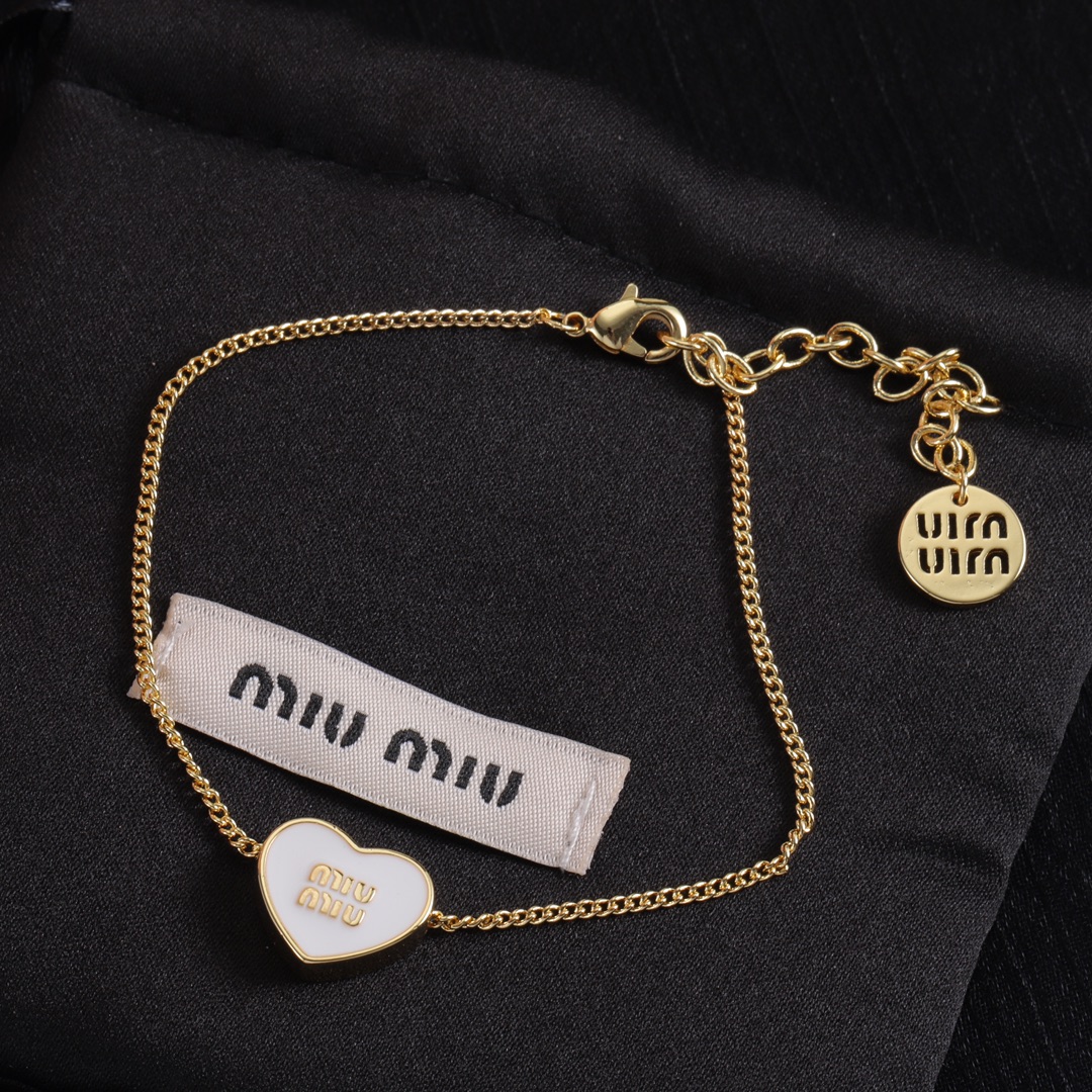 M heart design earrings