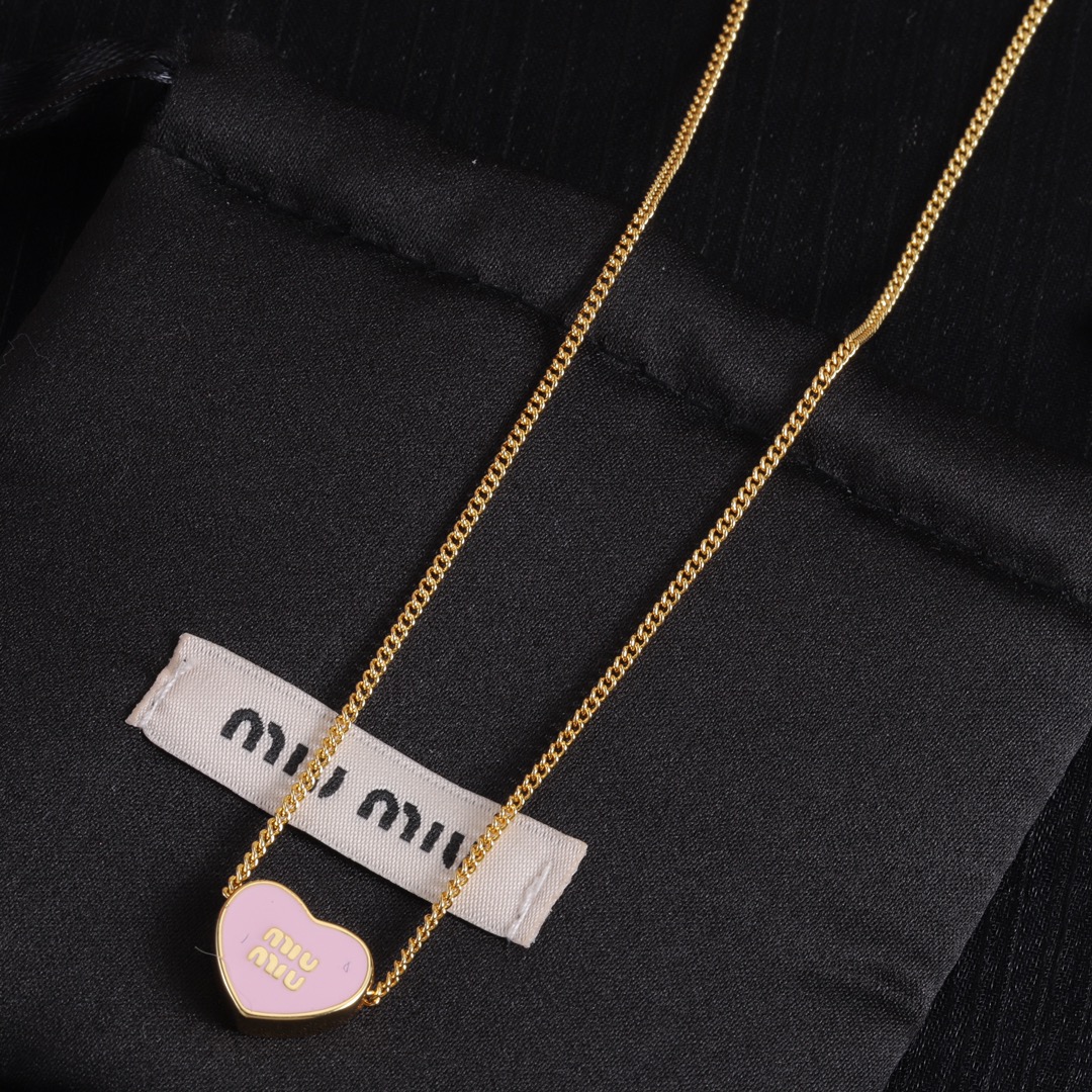 M heart design earrings