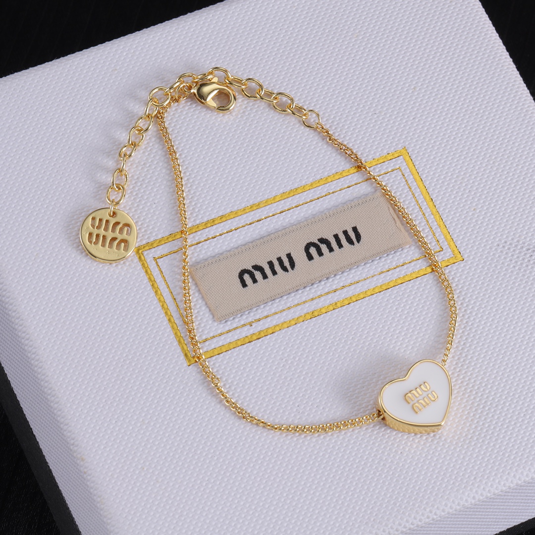 M heart design earrings