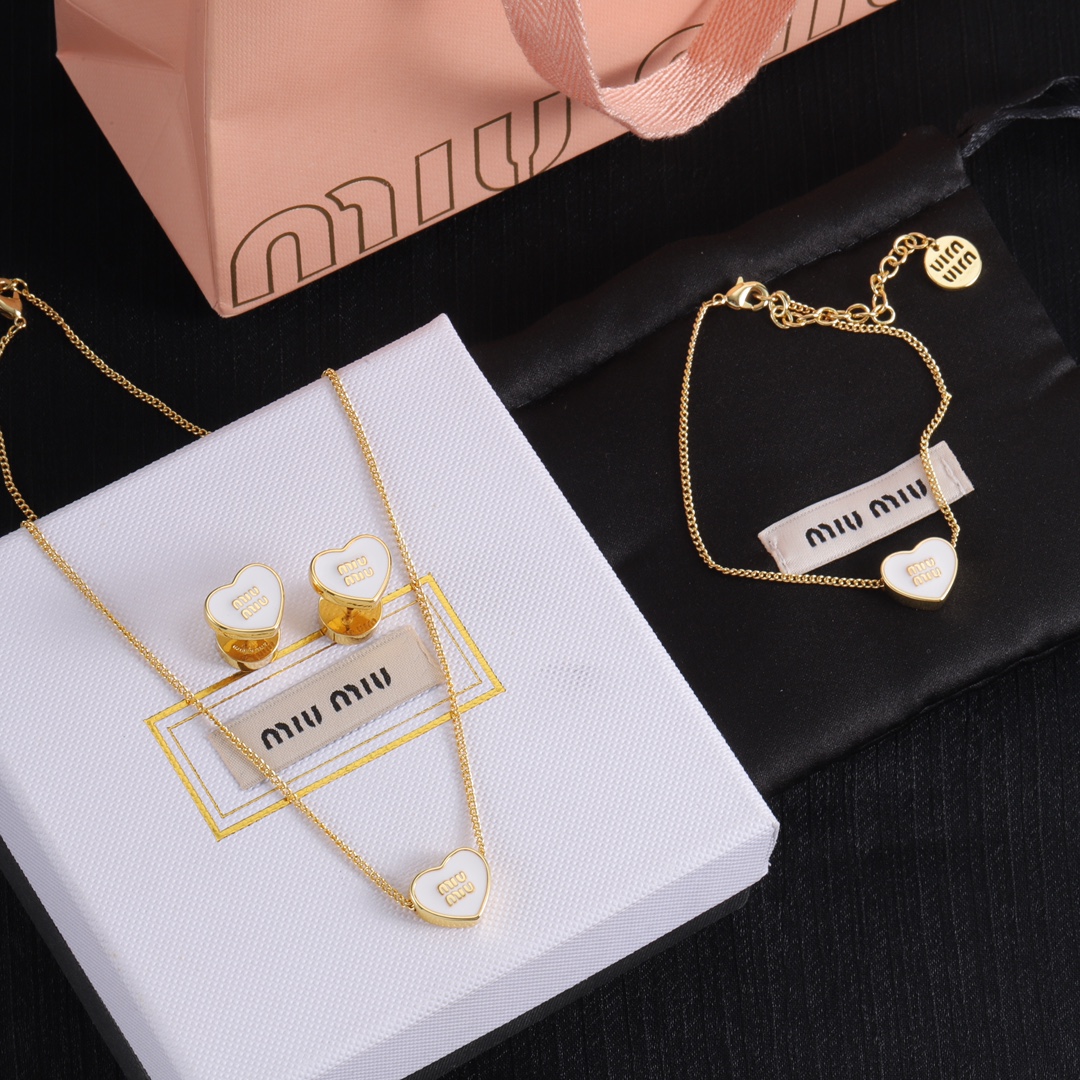 M heart design earrings