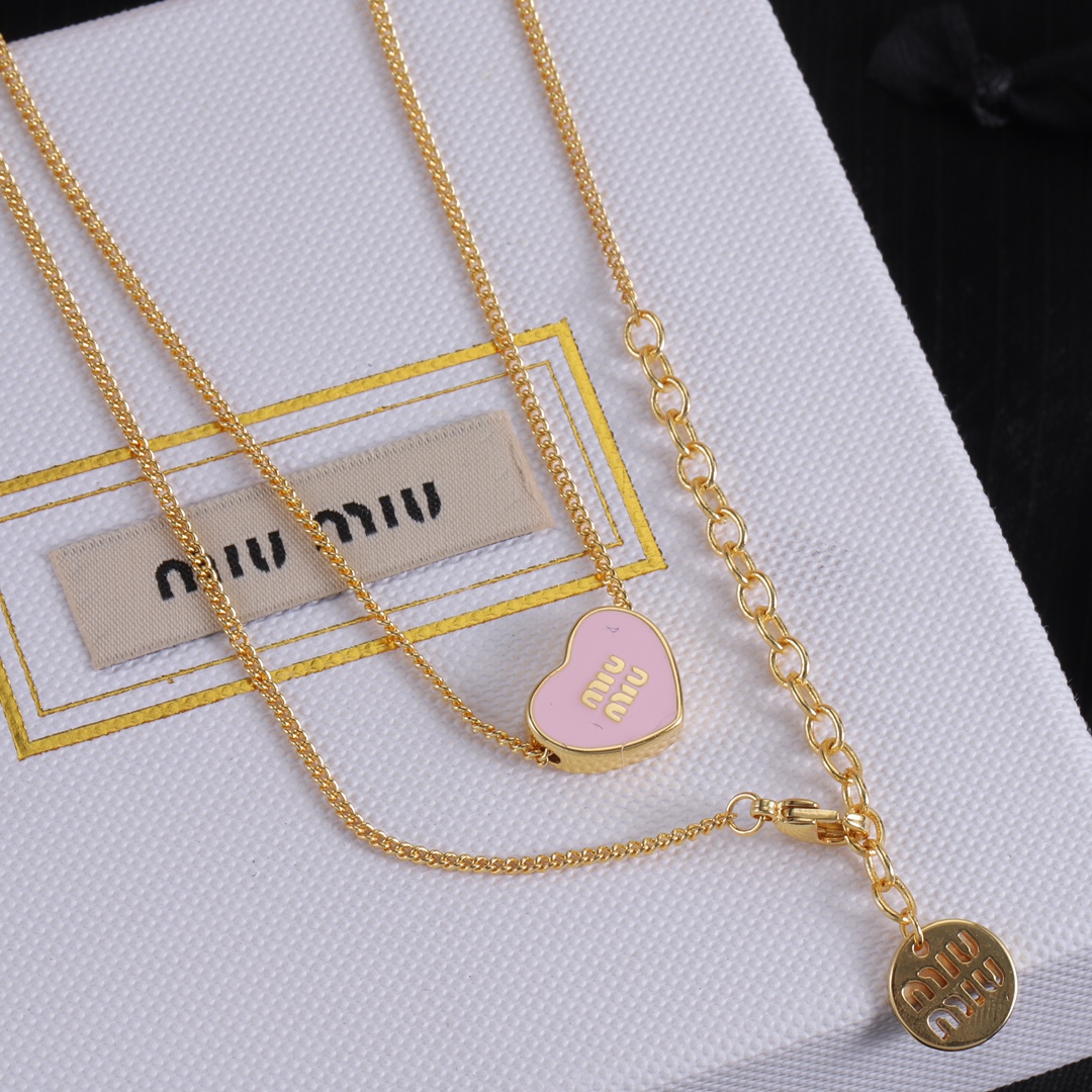 M heart design earrings