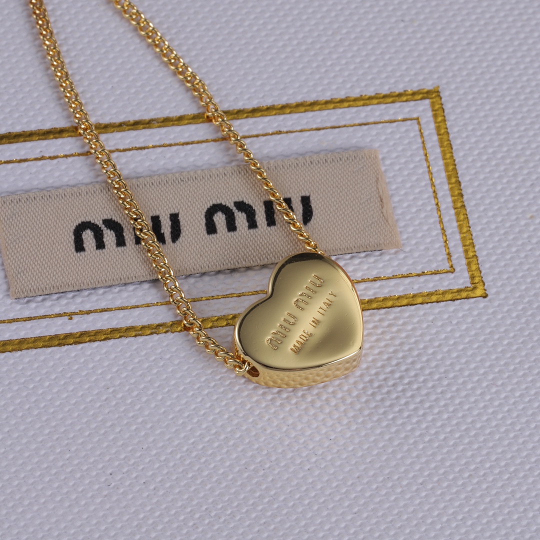 M heart design earrings