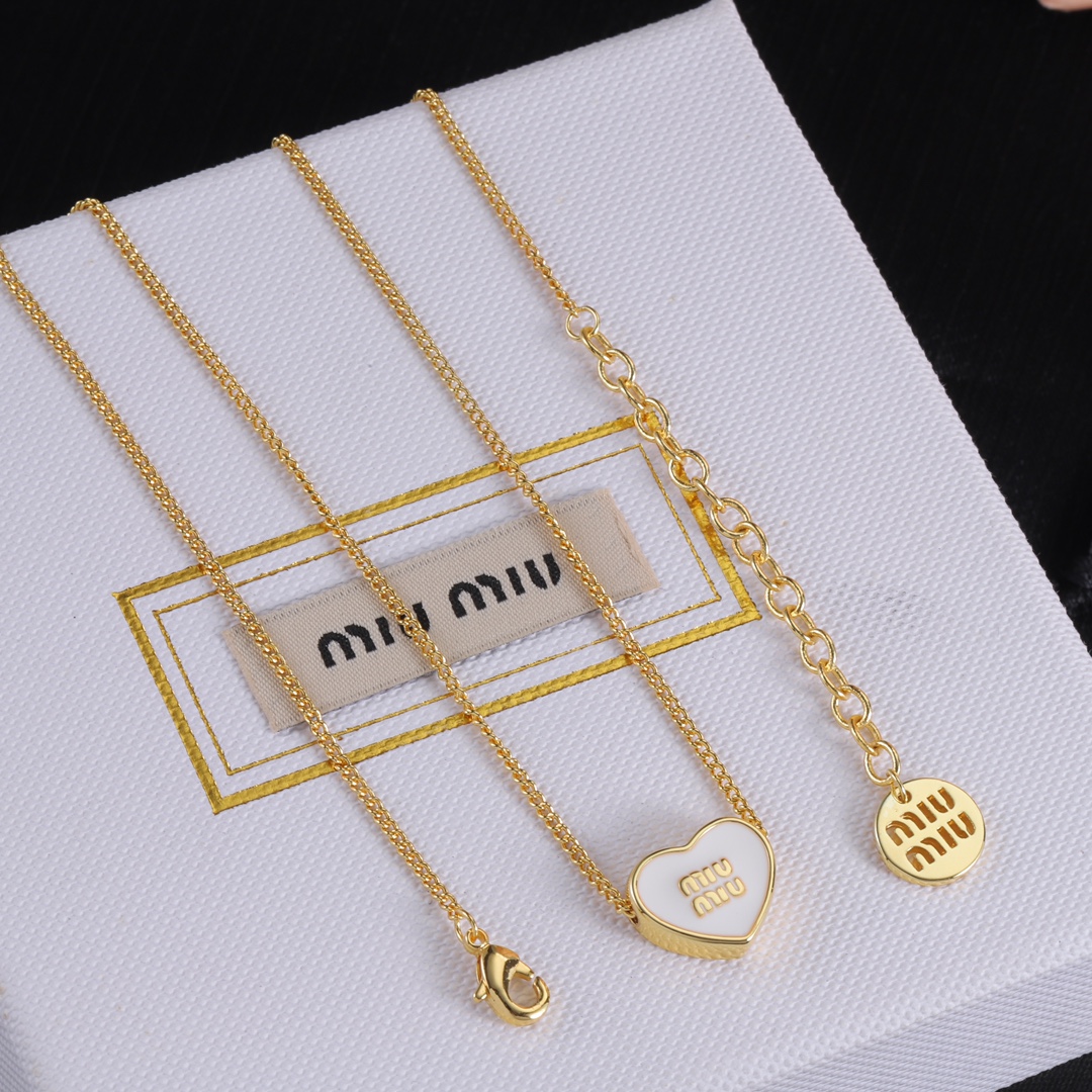 M heart design earrings