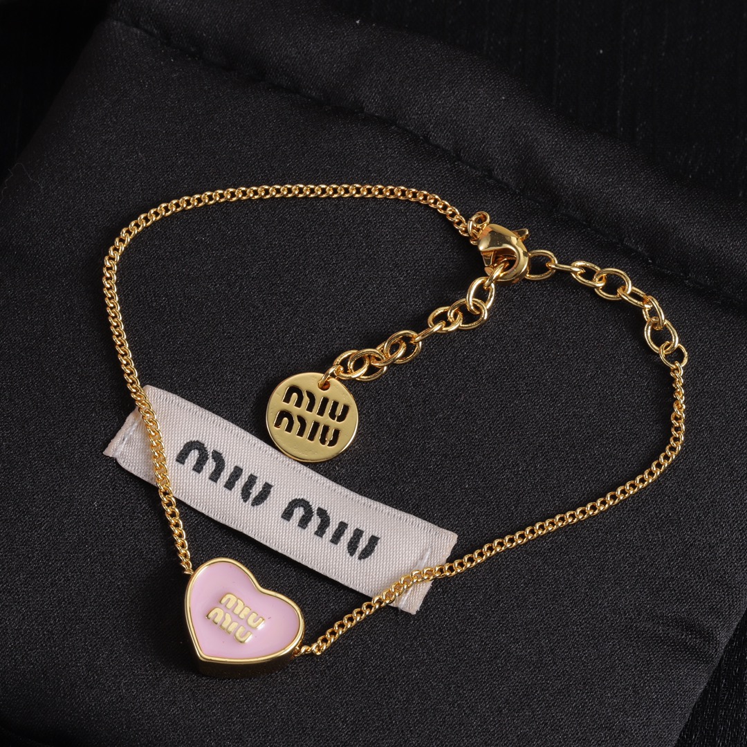 M heart design earrings