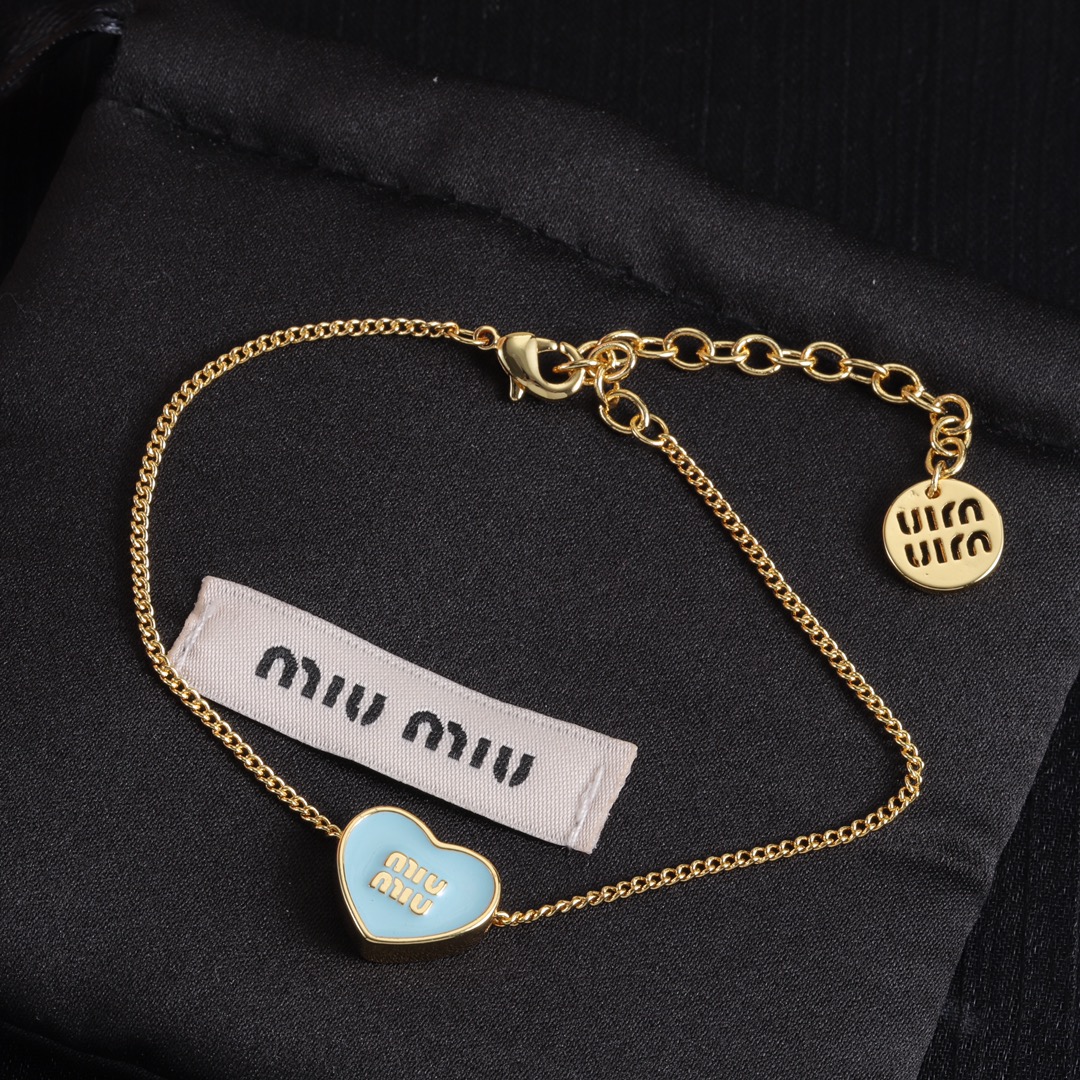 M heart design earrings