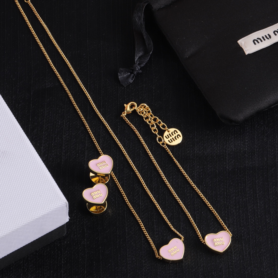 M heart design earrings