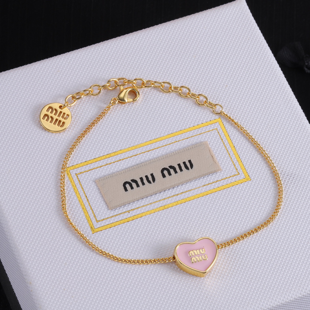 M heart design earrings