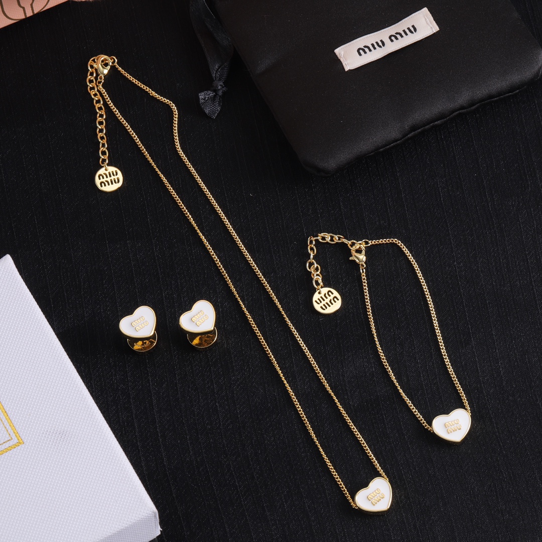 M heart design earrings