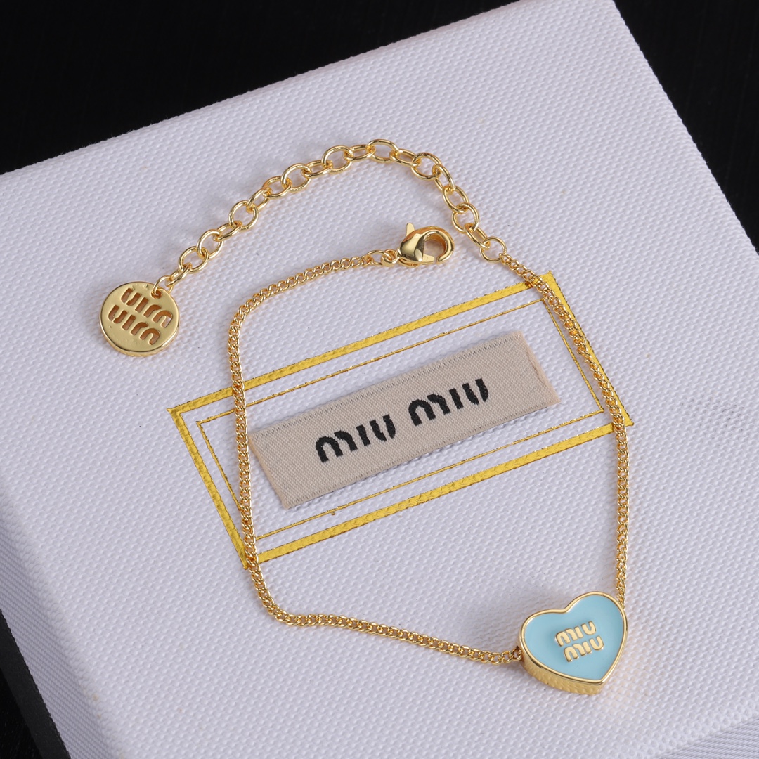 M heart design earrings