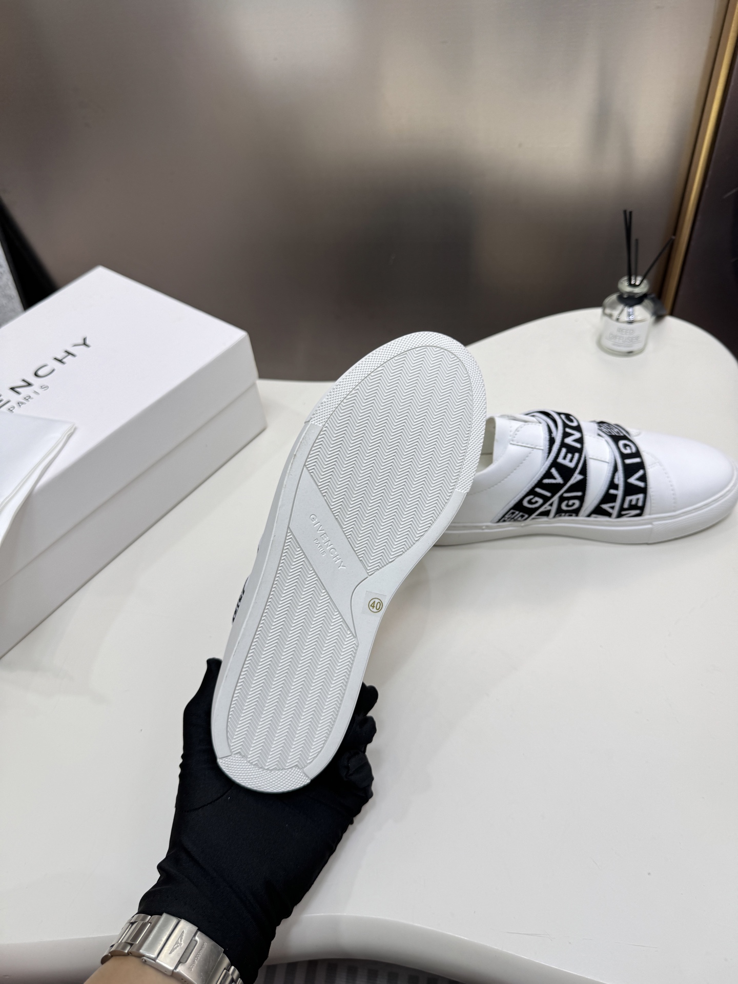 G  Thick-soled strap white sneakers.