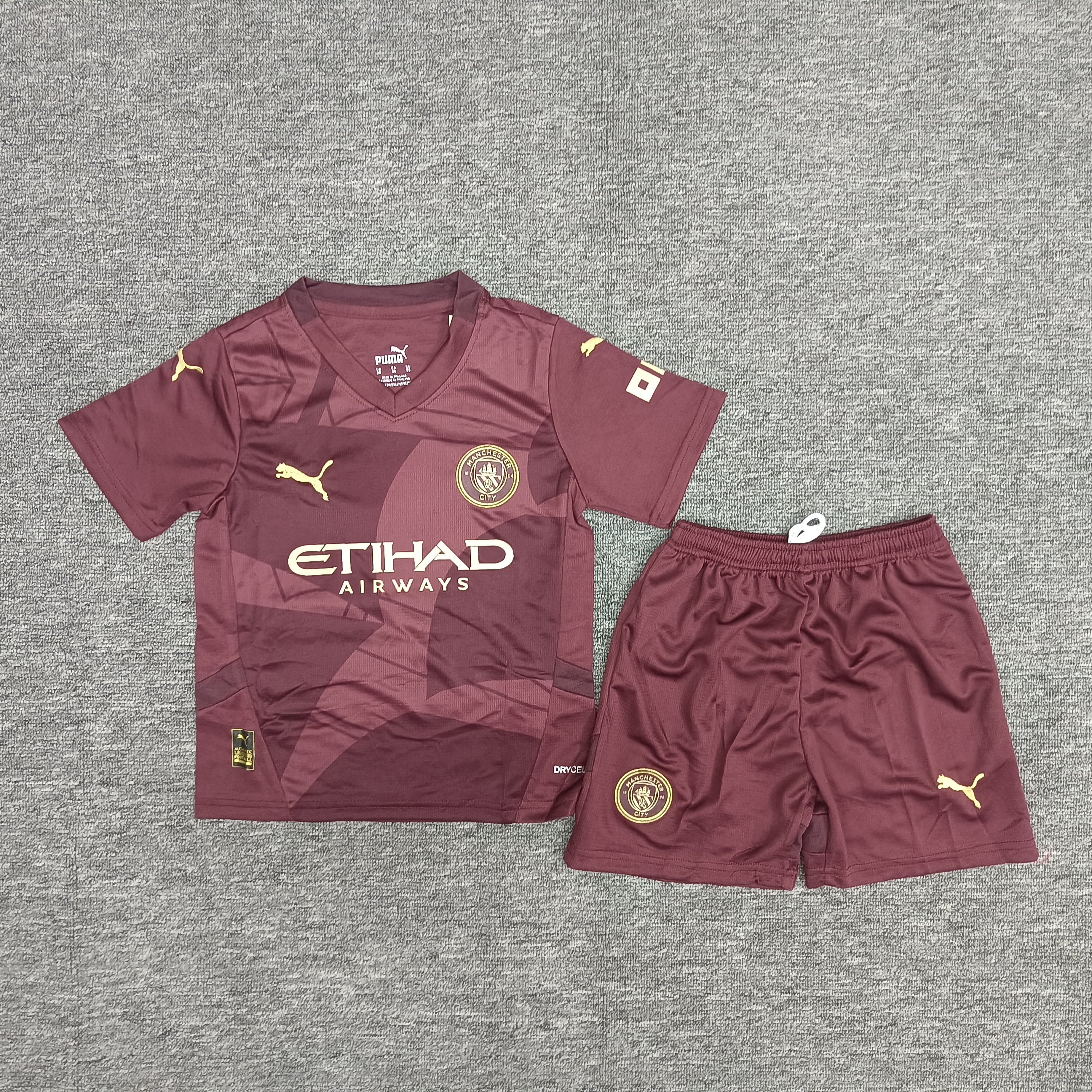 24-25 Manchester City's second away children's football uniform set