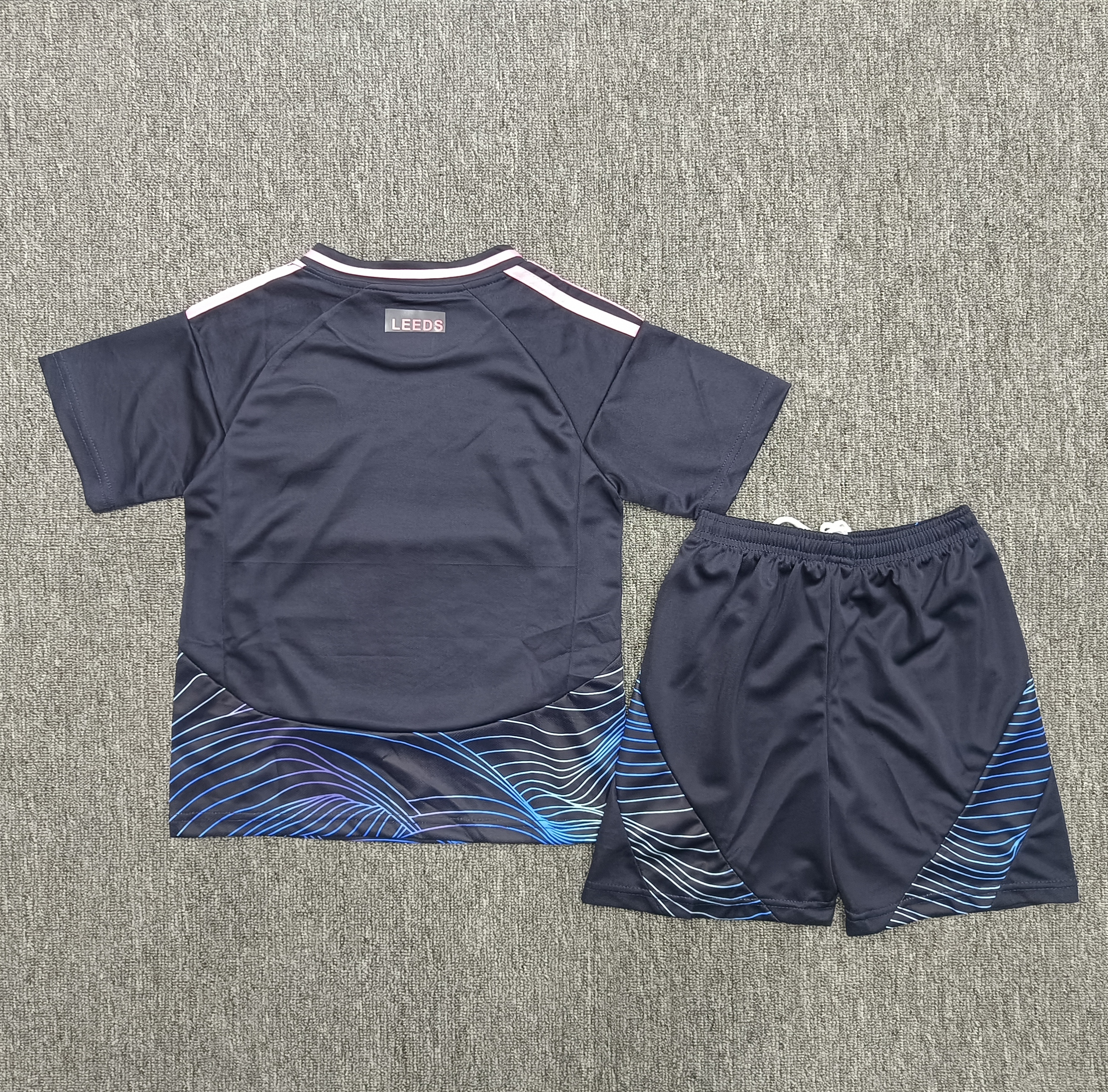 Tottenham Hotspur's second away children's football uniform set for 24-25