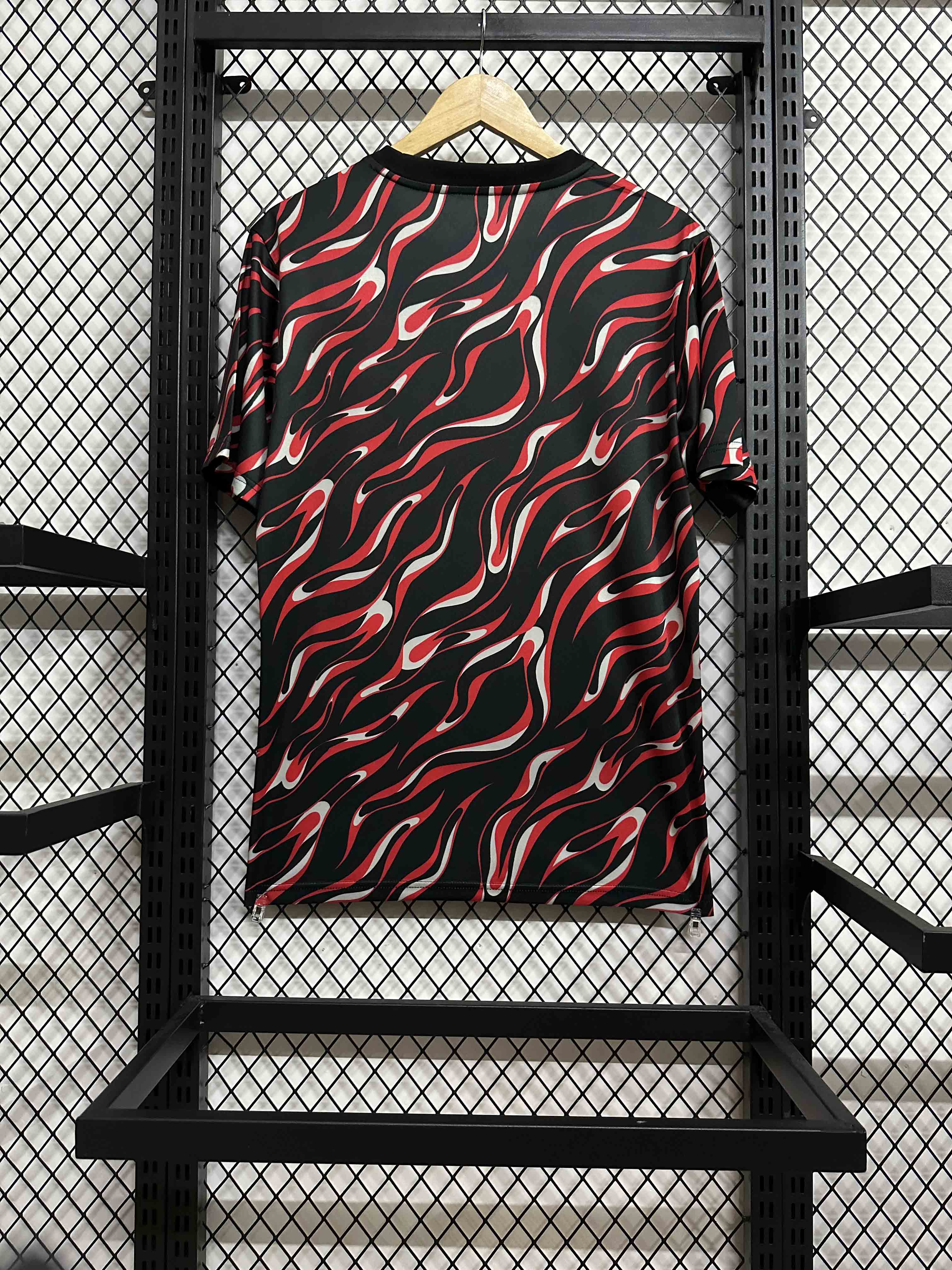 25-26 Manchester United's red and black training uniforms