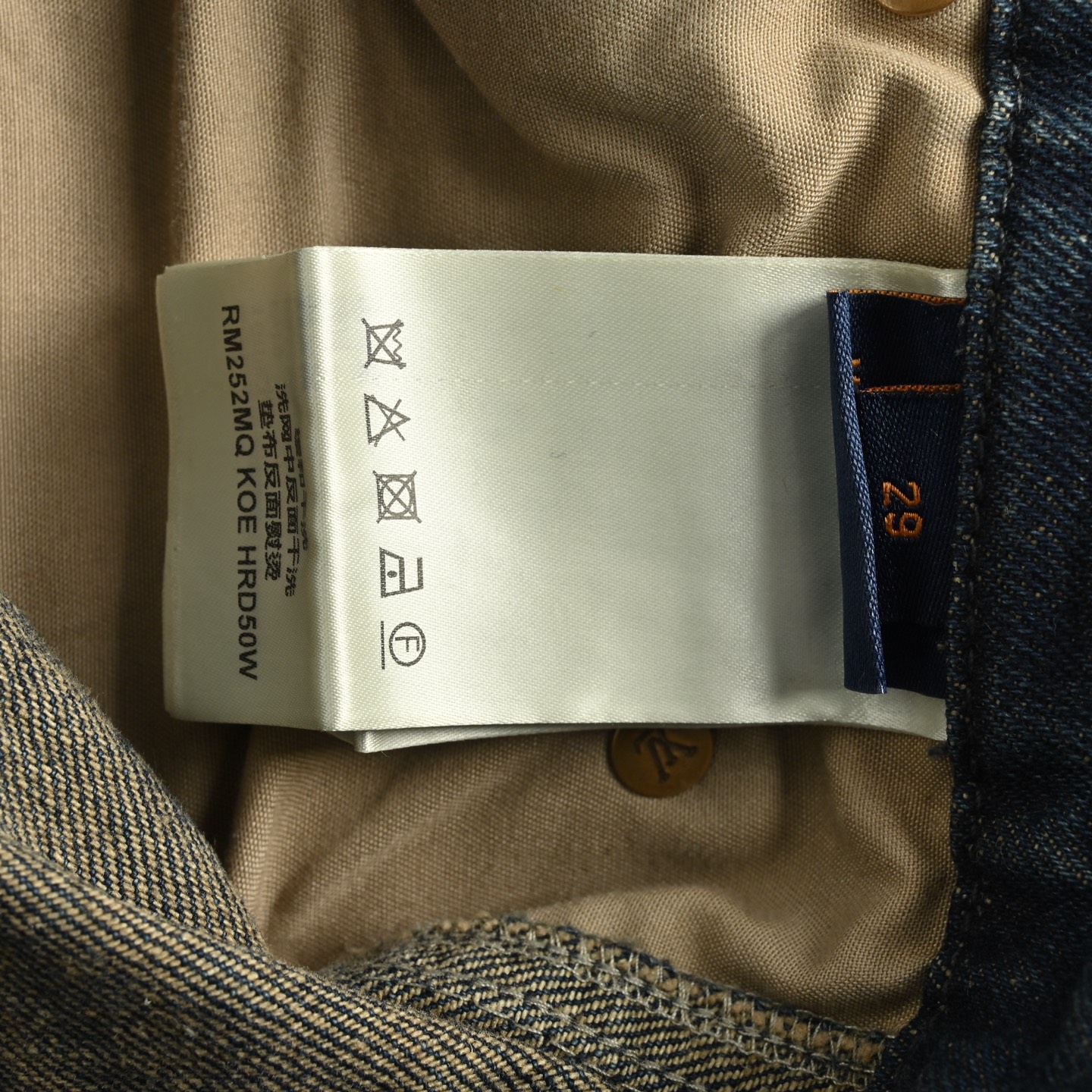 Denim shorts with embossed monogram pattern