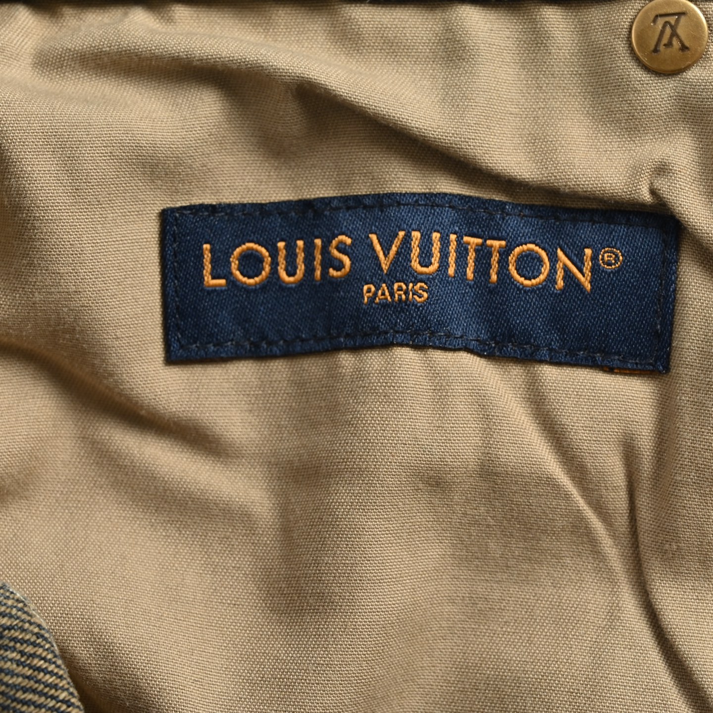 Denim shorts with embossed monogram pattern