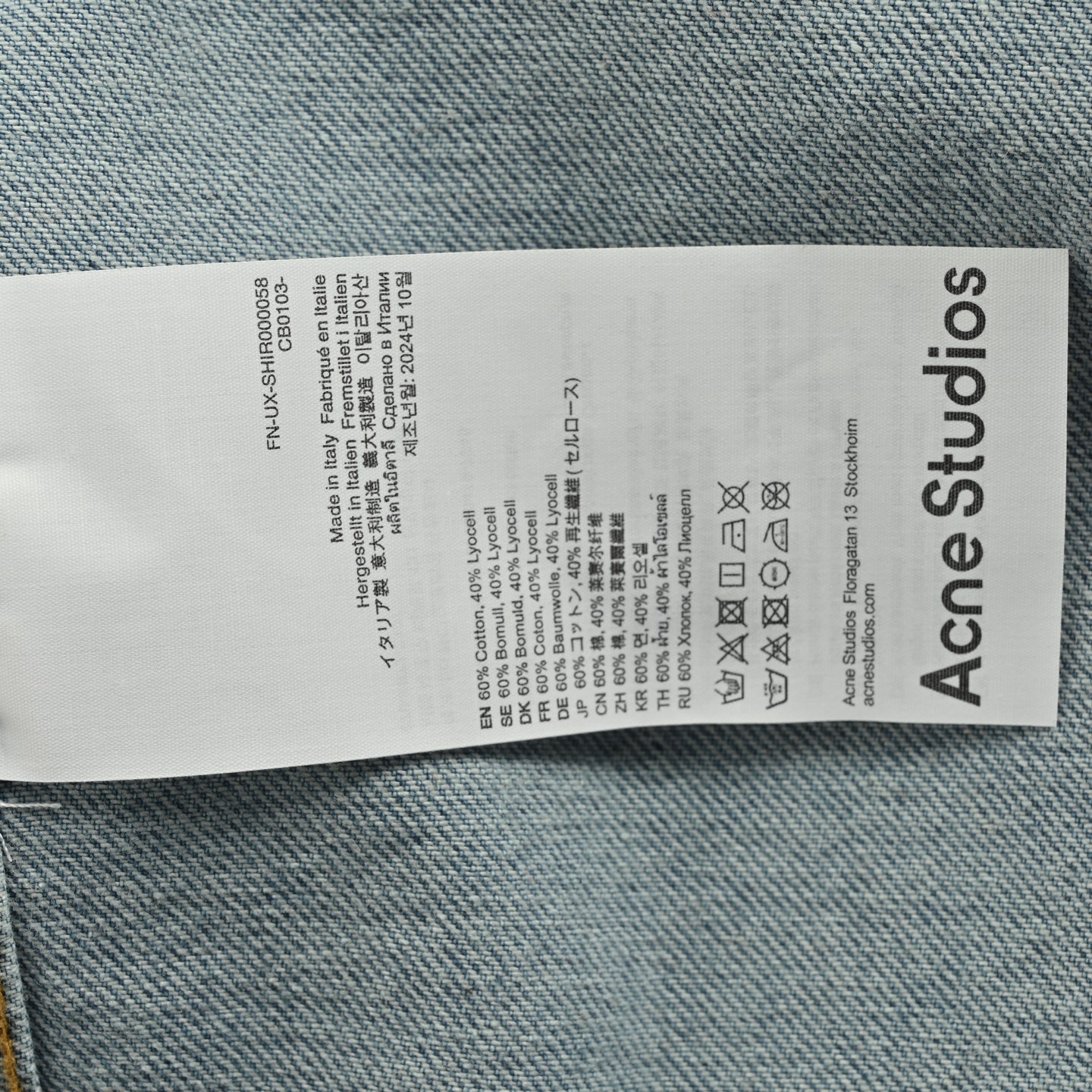 Ink-splashed button-down denim shirt