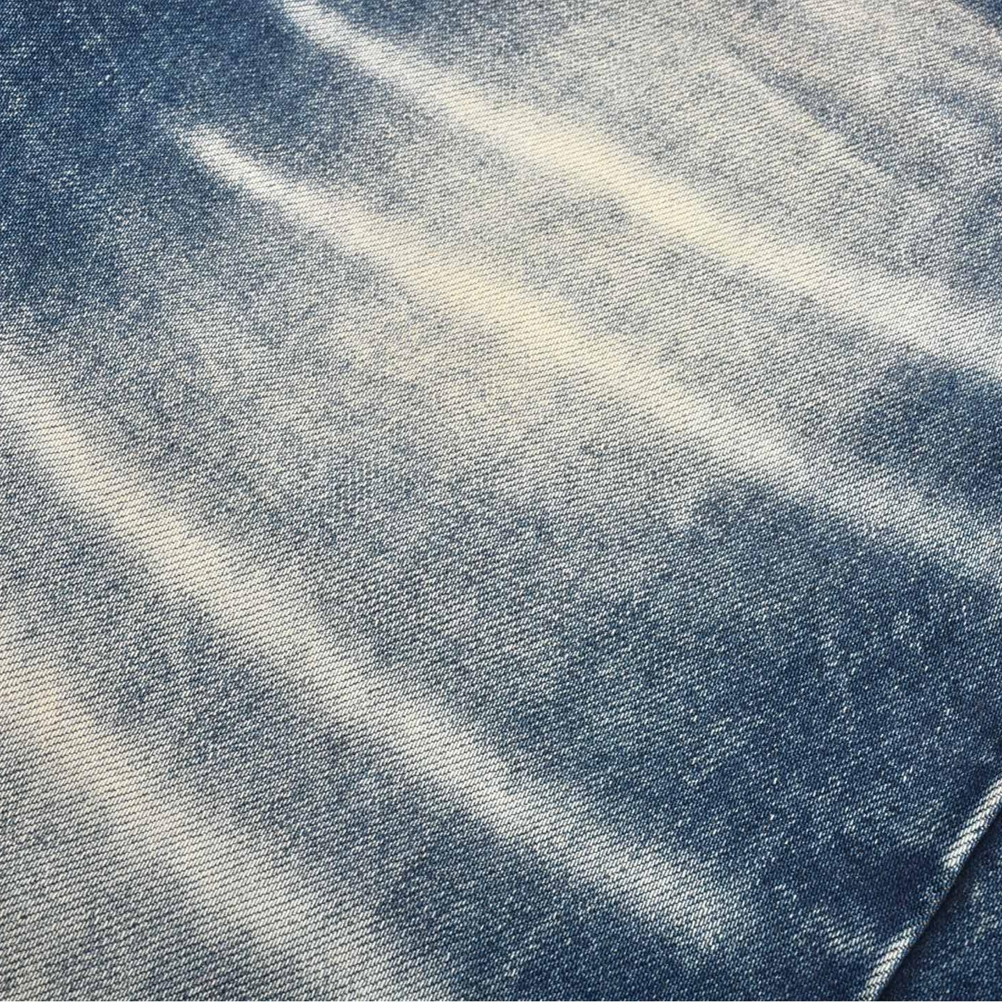 Abnormally faded leather label jeans