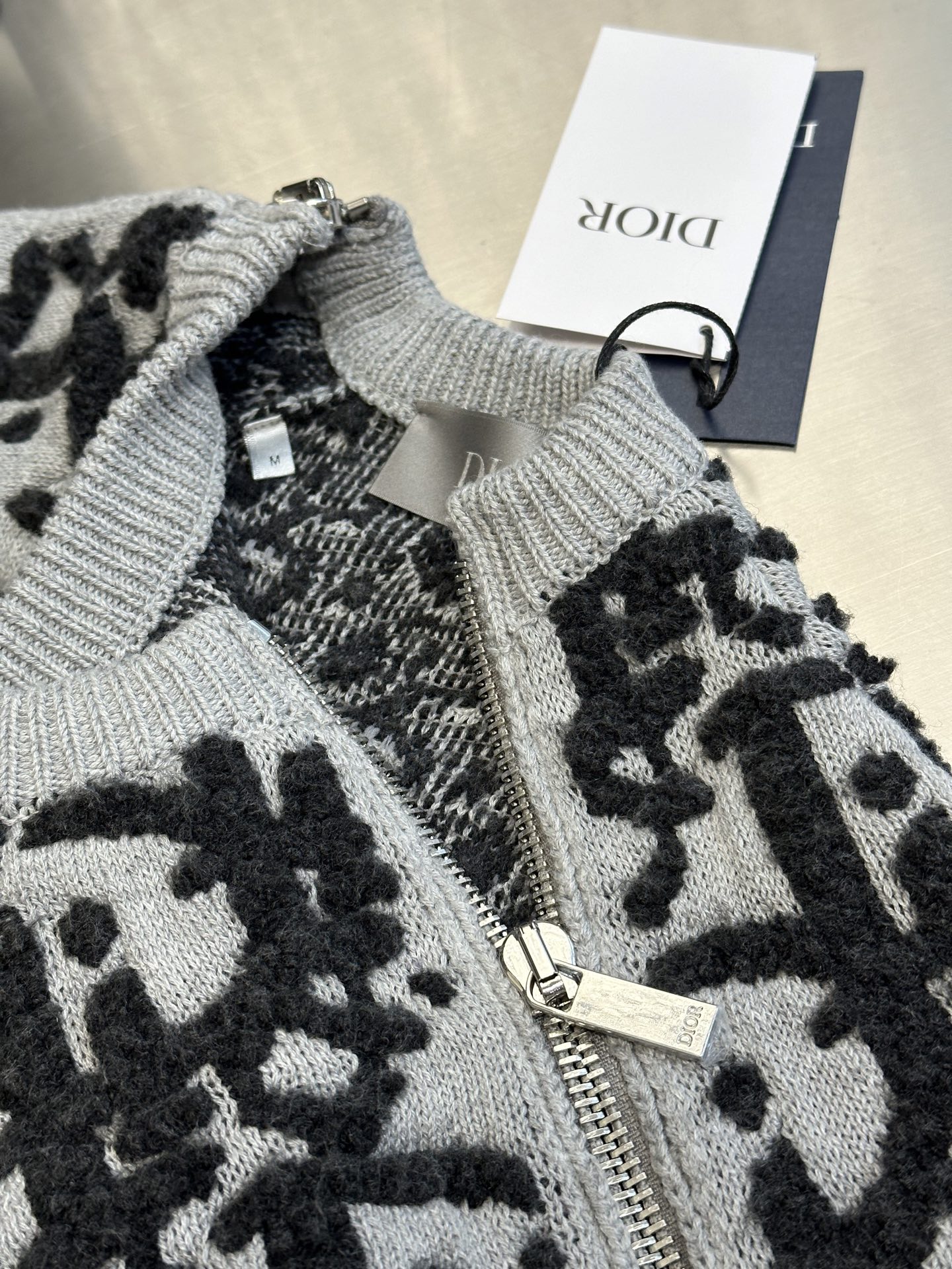 Double-sided jacquard zip-up knitted sweater