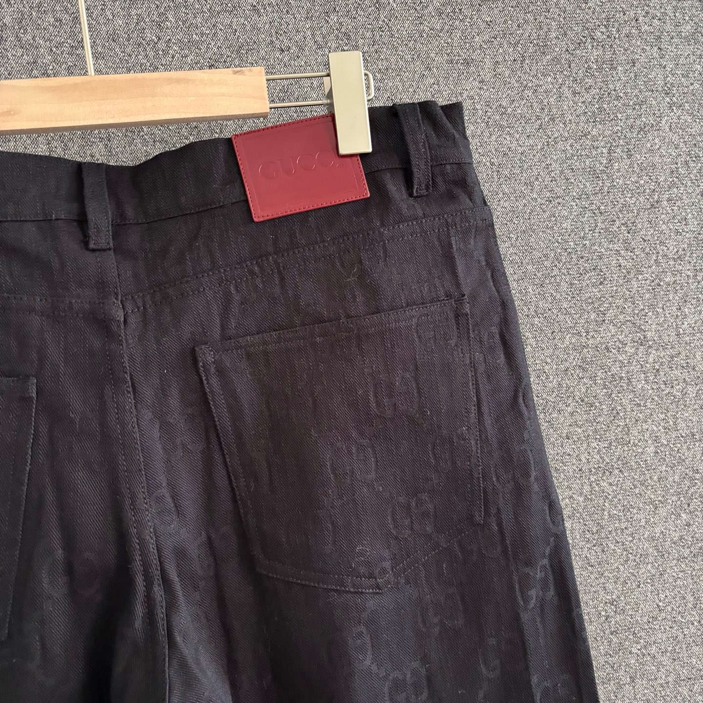 Black embossed denim trousers