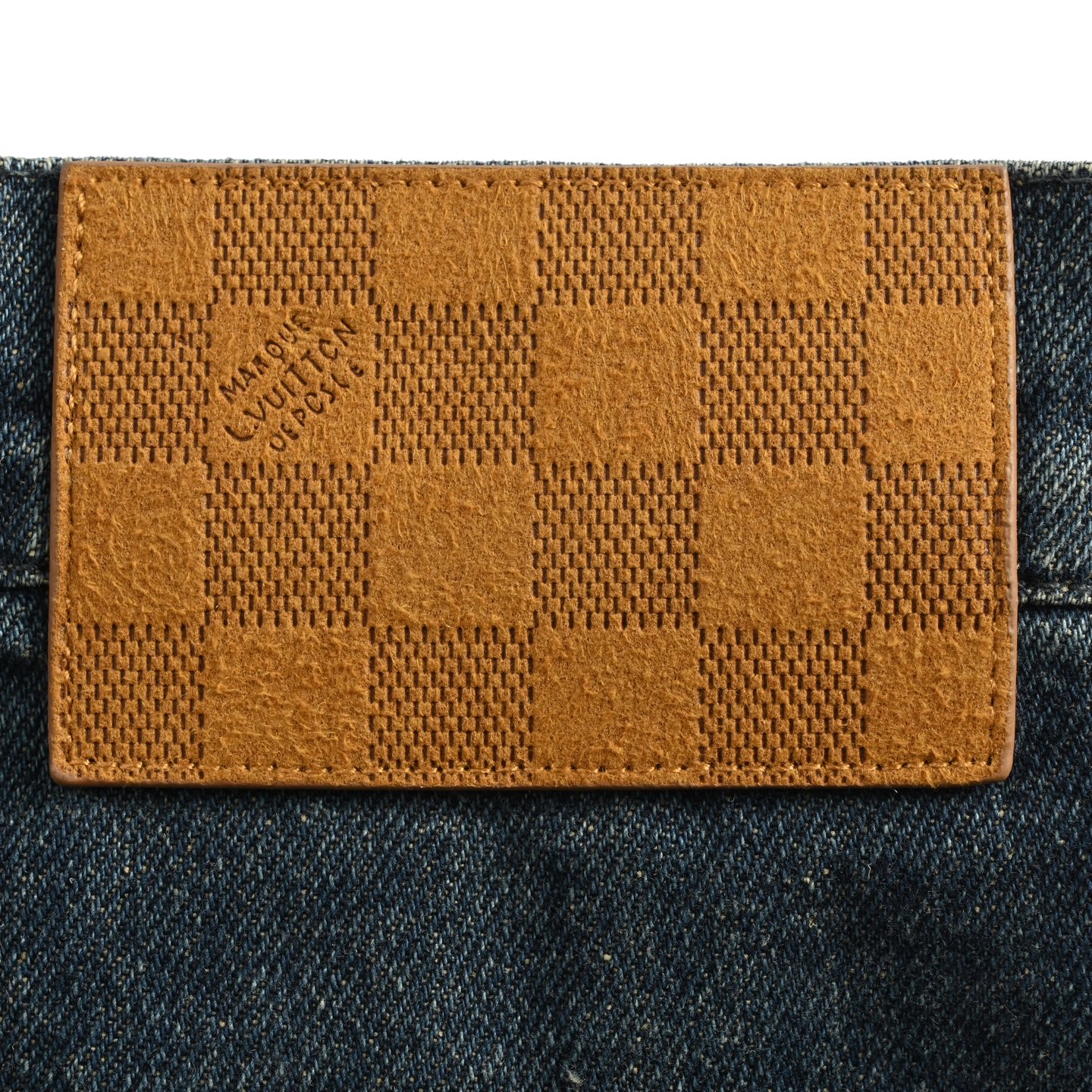 Denim shorts with embossed monogram pattern