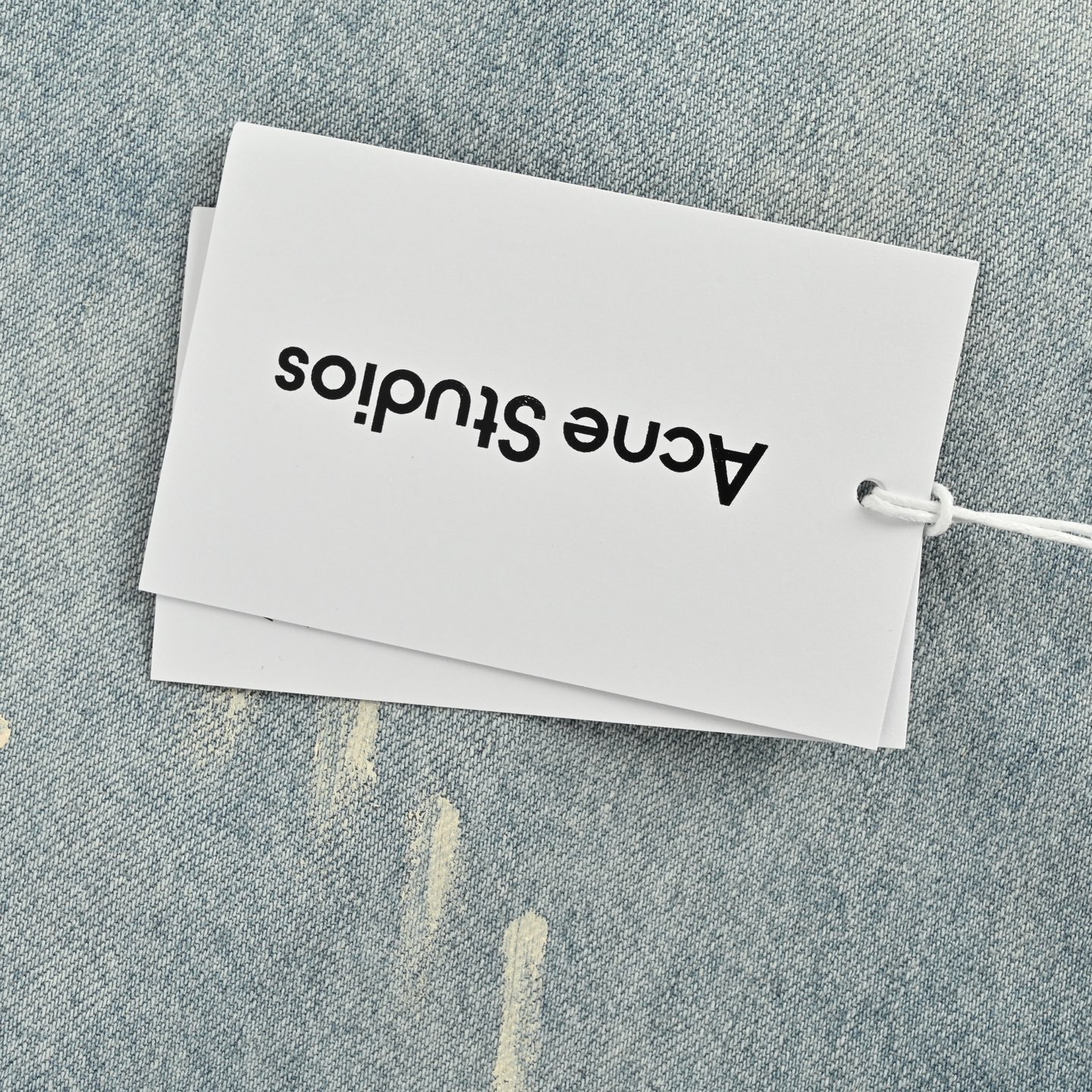 Ink-splashed button-down denim shirt