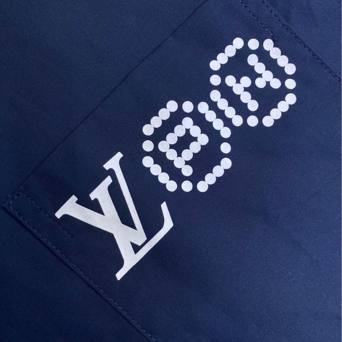 Blue shirt with co-branded signature print