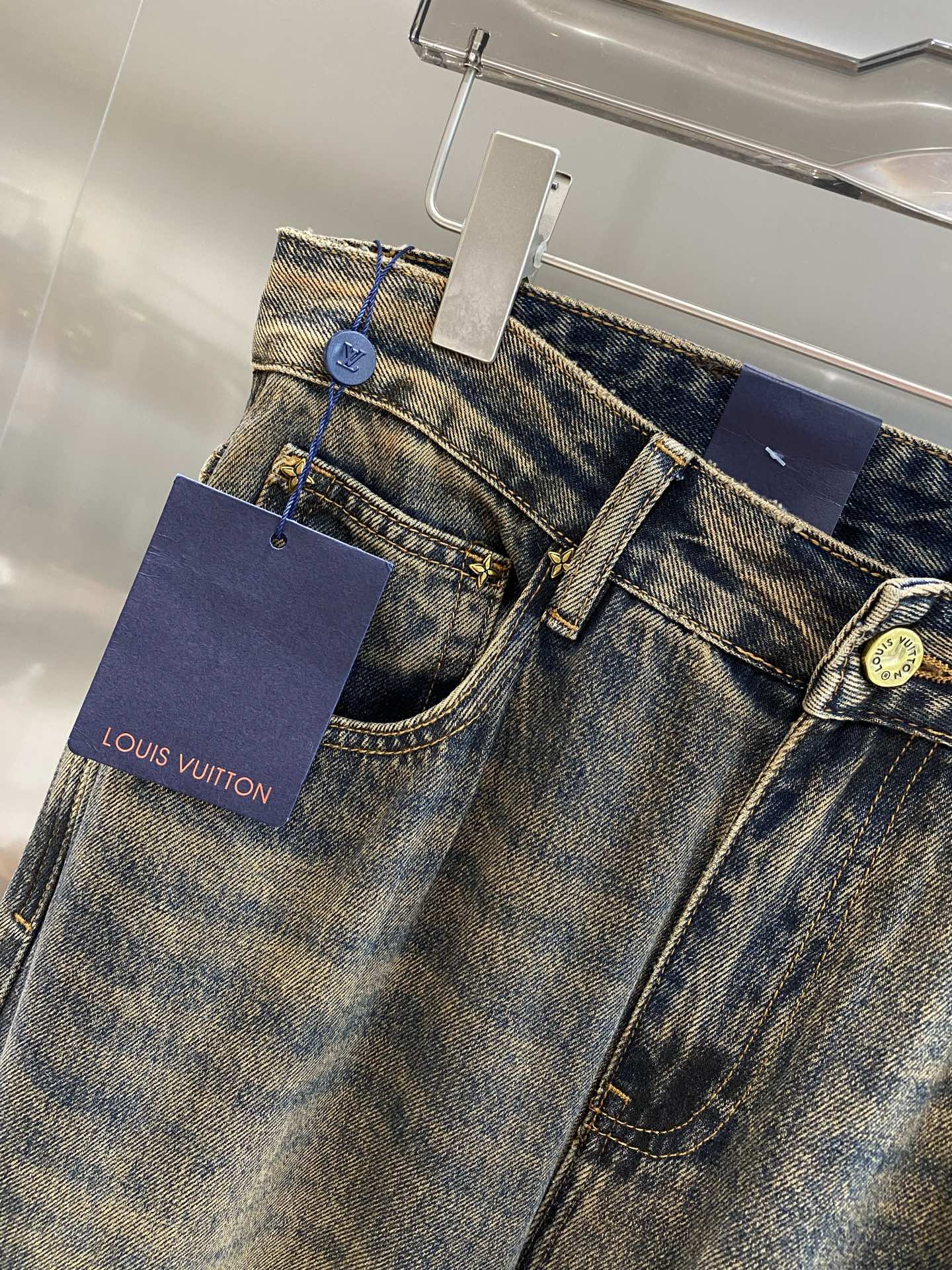 Distressed washed denim jeans