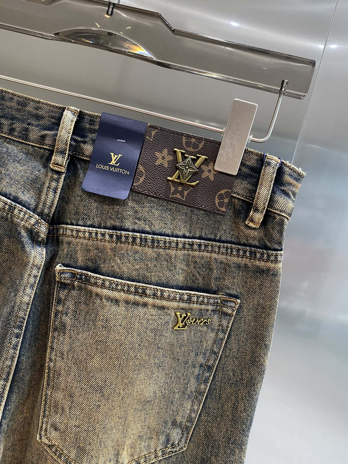 Distressed washed denim jeans